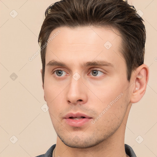 Neutral white young-adult male with short  brown hair and brown eyes