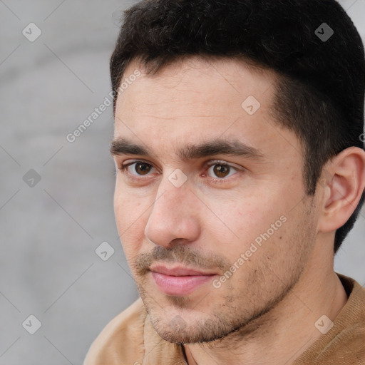 Neutral white young-adult male with short  brown hair and brown eyes