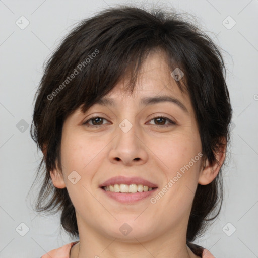 Joyful white adult female with medium  brown hair and brown eyes