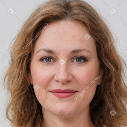 Joyful white adult female with long  brown hair and brown eyes