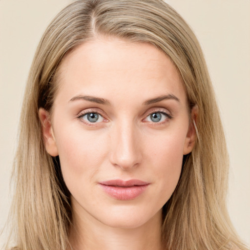 Joyful white young-adult female with long  brown hair and green eyes