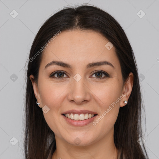 Joyful white young-adult female with long  brown hair and brown eyes