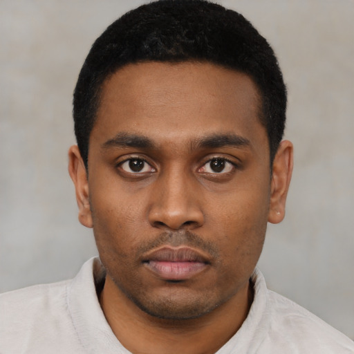 Neutral latino young-adult male with short  black hair and brown eyes