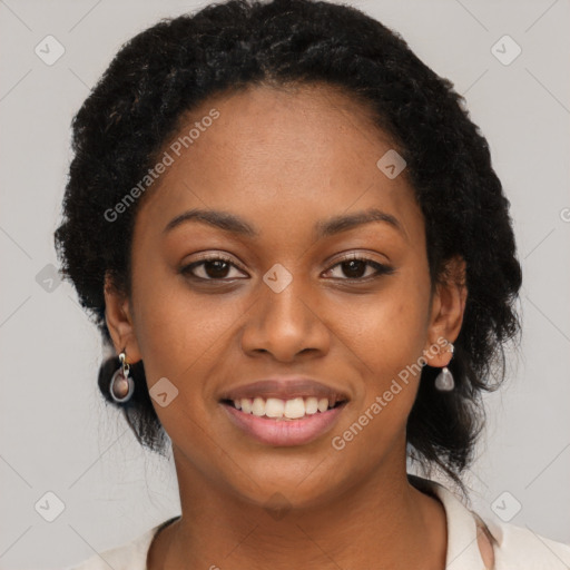 Joyful black young-adult female with medium  black hair and brown eyes