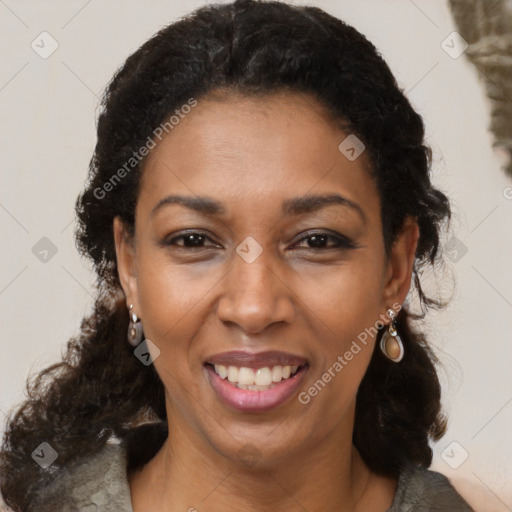 Joyful latino adult female with medium  brown hair and brown eyes