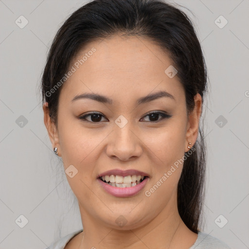 Joyful asian young-adult female with medium  brown hair and brown eyes