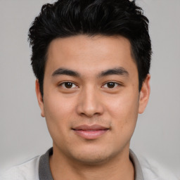 Joyful asian young-adult male with short  black hair and brown eyes