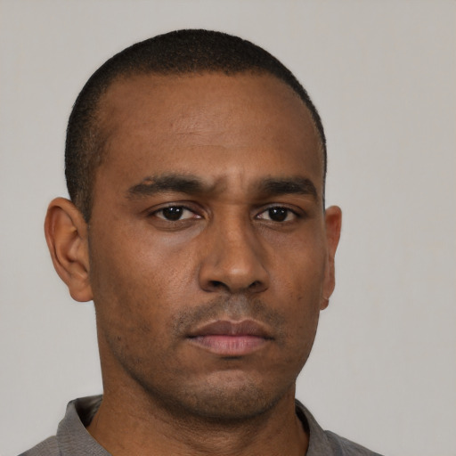 Neutral black young-adult male with short  black hair and brown eyes