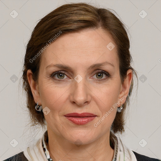 Joyful white adult female with medium  brown hair and grey eyes