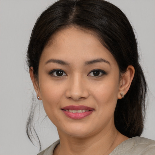 Joyful asian young-adult female with medium  brown hair and brown eyes