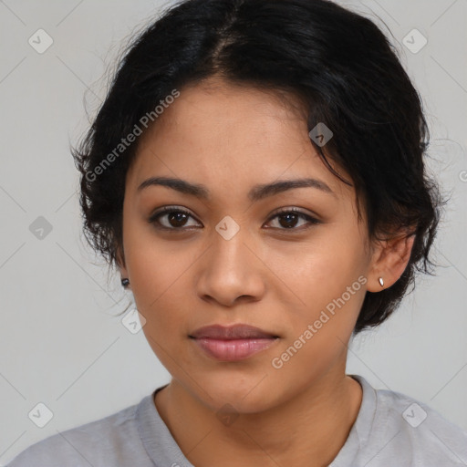 Joyful latino young-adult female with medium  black hair and brown eyes