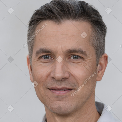 Joyful white adult male with short  brown hair and brown eyes