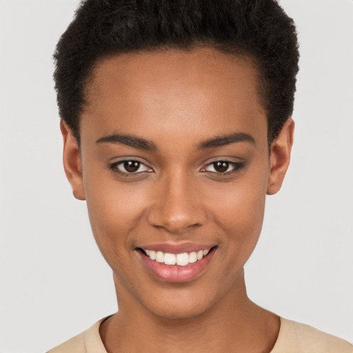 Joyful black young-adult female with short  black hair and brown eyes