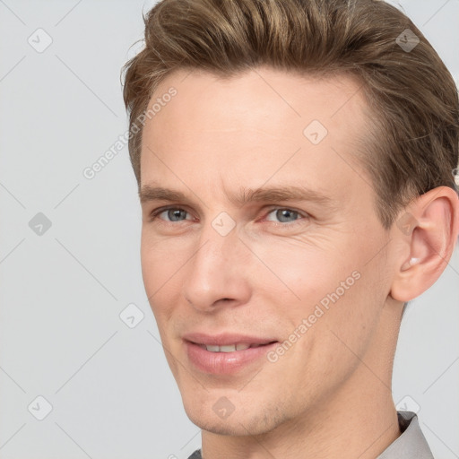 Joyful white adult male with short  brown hair and grey eyes