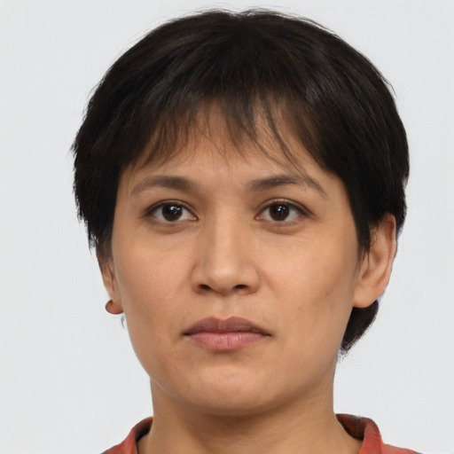 Neutral asian adult female with short  brown hair and brown eyes