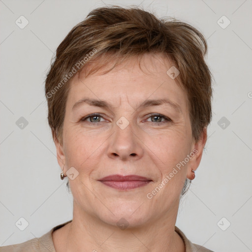 Joyful white adult female with short  brown hair and grey eyes