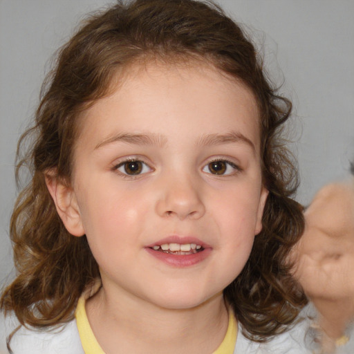 Joyful white child female with medium  brown hair and brown eyes