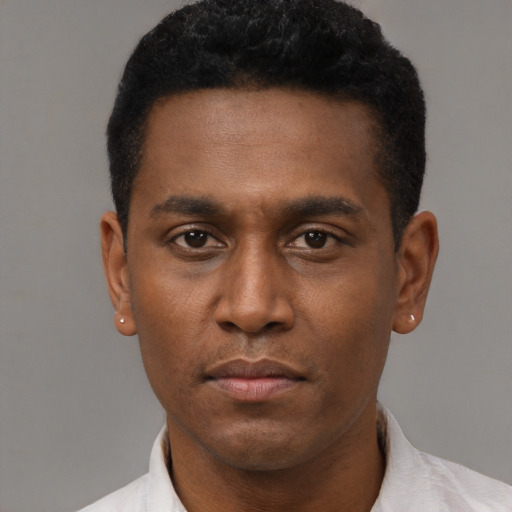 Neutral latino young-adult male with short  black hair and brown eyes