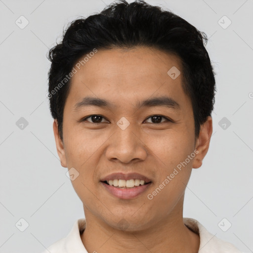 Joyful asian young-adult male with short  black hair and brown eyes