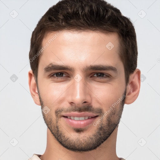 Joyful white young-adult male with short  brown hair and brown eyes