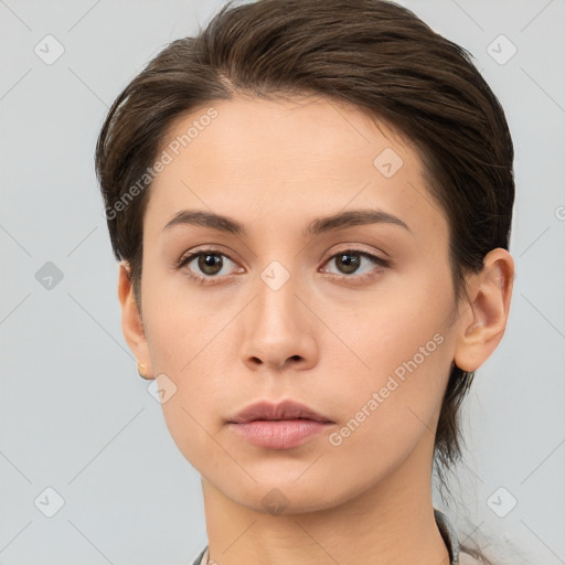 Neutral white young-adult female with medium  brown hair and brown eyes