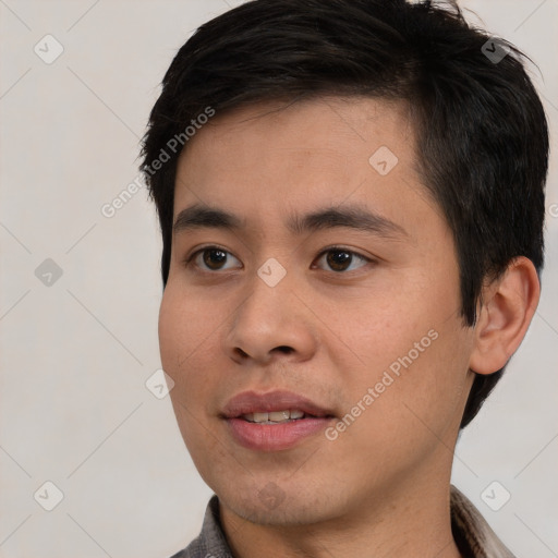 Joyful white young-adult male with short  black hair and brown eyes