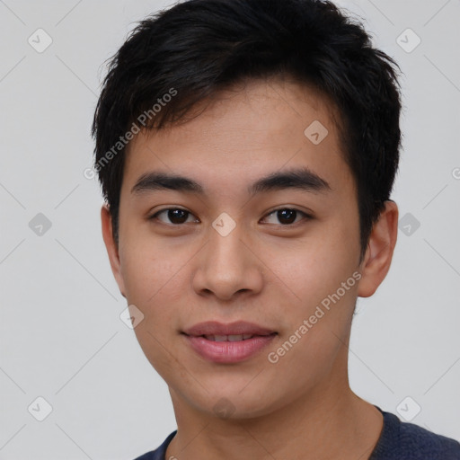 Joyful asian young-adult male with short  black hair and brown eyes