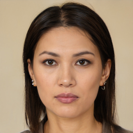 Neutral white young-adult female with long  brown hair and brown eyes