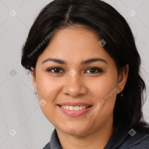 Joyful latino young-adult female with medium  brown hair and brown eyes