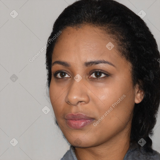 Joyful black young-adult female with medium  black hair and brown eyes