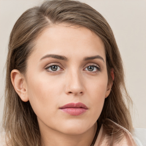 Neutral white young-adult female with long  brown hair and brown eyes