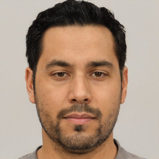 Neutral latino adult male with short  black hair and brown eyes