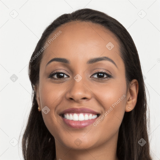 Joyful latino young-adult female with long  brown hair and brown eyes