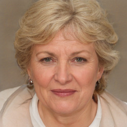 Joyful white middle-aged female with medium  brown hair and brown eyes