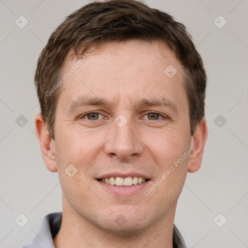 Joyful white adult male with short  brown hair and brown eyes