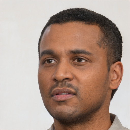 Neutral black young-adult male with short  black hair and brown eyes