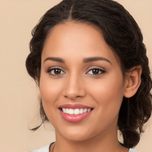 Joyful white young-adult female with medium  brown hair and brown eyes