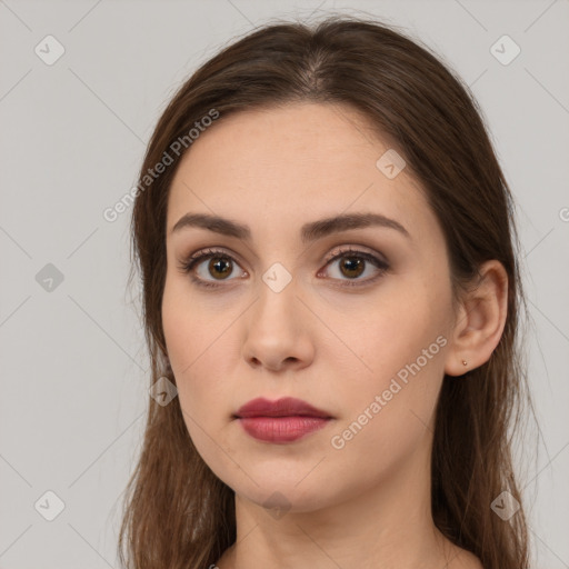 Neutral white young-adult female with long  brown hair and brown eyes