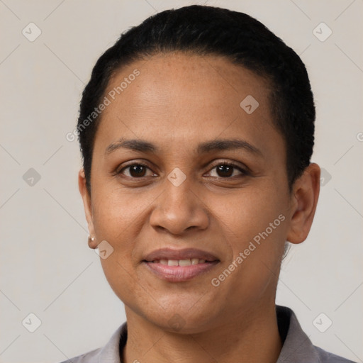 Joyful latino young-adult female with short  black hair and brown eyes