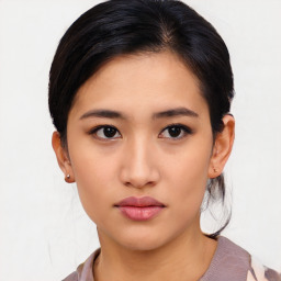 Neutral asian young-adult female with medium  black hair and brown eyes