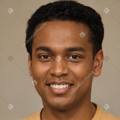 Joyful black young-adult male with short  black hair and brown eyes