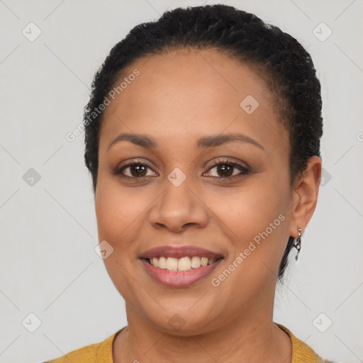 Joyful latino young-adult female with short  brown hair and brown eyes