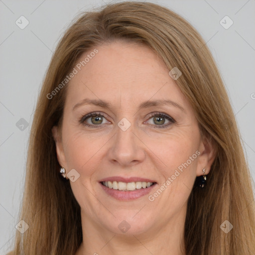 Joyful white adult female with long  brown hair and grey eyes