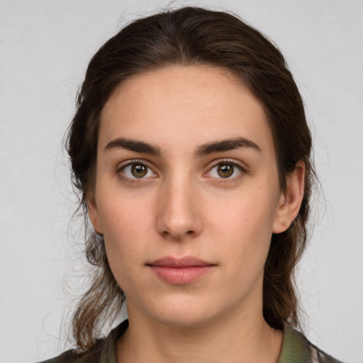 Neutral white young-adult female with medium  brown hair and brown eyes