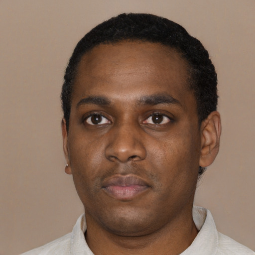 Neutral black young-adult male with short  black hair and brown eyes