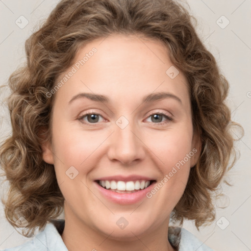 Joyful white young-adult female with medium  brown hair and green eyes