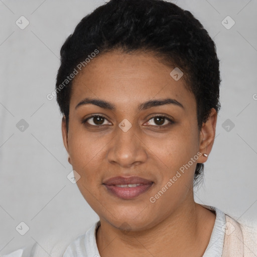 Joyful latino young-adult female with short  black hair and brown eyes