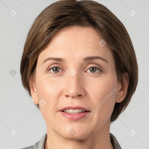 Joyful white adult female with short  brown hair and grey eyes