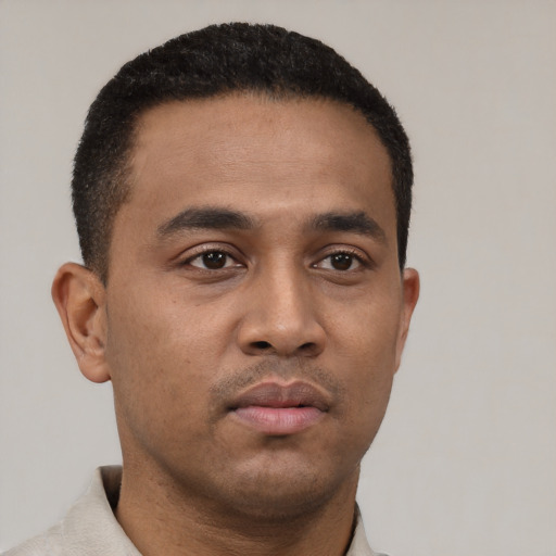 Neutral latino young-adult male with short  black hair and brown eyes