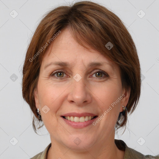 Joyful white adult female with medium  brown hair and grey eyes